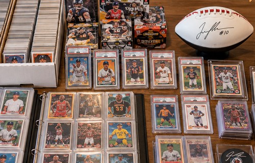 Collection of sports card boxes and binders viewed together